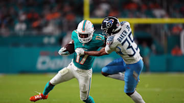 Sep 30, 2024; Miami Gardens, Florida, USA; Tennessee Titans cornerback Darrell Baker Jr. (39) attempts to bring down Miami Dolphins wide receiver Jaylen Waddle (17) during the second half at Hard Rock Stadium. Mandatory Credit: Jasen Vinlove-Imagn Images