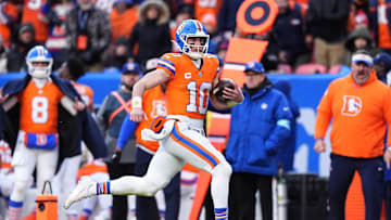 Jan 5, 2025; Denver, Colorado, USA; Denver Broncos quarterback Bo Nix (10) scrambles with the ball in the second quarter against the Kansas City Chiefs at Empower Field at Mile High. Mandatory Credit: Ron Chenoy-Imagn Images