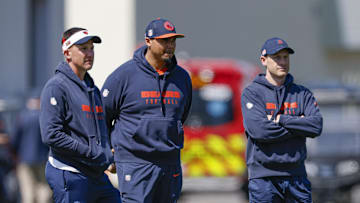 May 9, 2025; Lake Forest, IL, USA; Chicago Bears defensive coordinator Dennis Allen (L), general manager Ryan Poles (C) and head coach Ben Johnson (R) observe during the Rookie Minicamp at Halas Hall. Mandatory Credit: Kamil Krzaczynski-Imagn Images