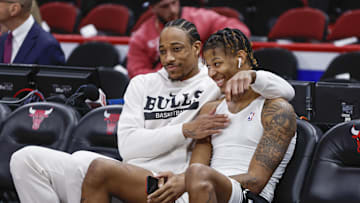 Feb 13, 2023; Chicago, Illinois, USA; Chicago Bulls forward DeMar DeRozan (L) jokes with Chicago Bulls forward Dalen Terry (R) before an NBA game against the Orlando Magic at United Center. Mandatory Credit: Kamil Krzaczynski-Imagn Images