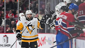 Dec 12, 2024; Montreal, Quebec, CAN; Pittsburgh Penguins right wing Bryan Rust (17) celebrates his second goal of the game with his teammates at the bench against the Montreal Canadiens during the second period at Bell Centre. Mandatory Credit: David Kirouac-Imagn Images