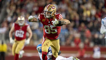 December 30, 2024; Santa Clara, California, USA; San Francisco 49ers tight end George Kittle (85) is tackled by Detroit Lions safety Ifeatu Melifonwu (6) during the fourth quarter at Levi's Stadium. Mandatory Credit: Kyle Terada-Imagn Images