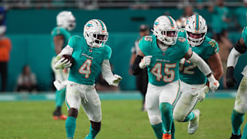 Dec 22, 2024; Miami Gardens, Florida, USA; Miami Dolphins cornerback Kader Kohou (4) runs with the ball after intercepting a pass from San Francisco 49ers quarterback Brock Purdy during second half at Hard Rock Stadium. Mandatory Credit: Jasen Vinlove-Imagn Images