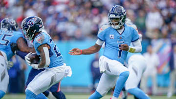 Tennessee Titans quarterback Cam Ward (1) hands off to running back Tony Pollard (20) during the second quarter at Nissan Stadium in Nashville, Tenn., Sunday, Oct. 19, 2025.