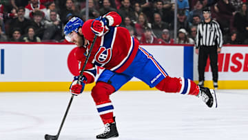 Dec 5, 2024; Montreal, Quebec, CAN; Montreal Canadiens defenseman David Savard (58) shoots the puck against the Nashville Predators during the second period at Bell Centre. Mandatory Credit: David Kirouac-Imagn Images