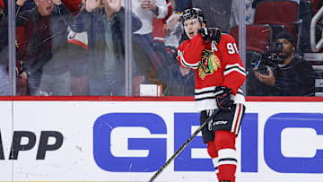 Nov 18, 2025; Chicago, Illinois, USA; Chicago Blackhawks center Connor Bedard (98) reacts after scoring against the Calgary Flames during the second period at United Center. Mandatory Credit: Kamil Krzaczynski-Imagn Images