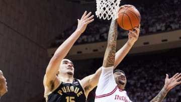 Jan 16, 2024; Bloomington, Indiana, USA; Purdue Boilermakers center Zach Edey (15) shoots the ball while Indiana Hoosiers center Kel'el Ware (1) defends in the second half at Simon Skjodt Assembly Hall. Mandatory Credit: Trevor Ruszkowski-USA TODAY Sports