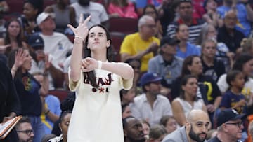 Jul 27, 2025; Chicago, Illinois, USA; Injured Indiana Fever guard Caitlin Clark (22) reacts during the first half of a basketball game against the Chicago Sky at United Center. Mandatory Credit: Kamil Krzaczynski-Imagn Images