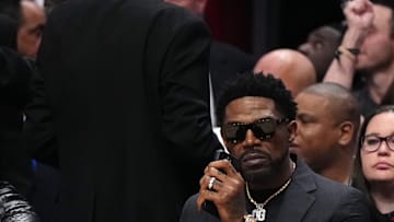 Jan 19, 2024; Miami, Florida, USA; Former Miami Heat player Udonis Haslem sits court-side during the first half between the Miami Heat and the Atlanta Hawks at Kaseya Center. Mandatory Credit: Jasen Vinlove-Imagn Images