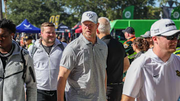 Nov 22, 2025; Orlando, Florida, USA; UCF Knights head coach Scott Frost walks into the venue before the game against the Oklahoma State Cowboys at Acrisure Bounce House. Mandatory Credit: Mike Watters-Imagn Images