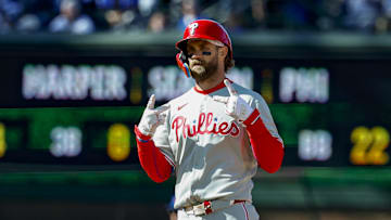 Apr 26, 2025; Chicago, Illinois, USA; Philadelphia Phillies first baseman Bryce Harper (3) celebrates after hitting a two-run double against the Chicago Cubs during the fourth inning at Wrigley Field. 