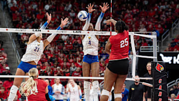 Louisville's Reese Robins (25) spiked the ball for a kill as the No. 3 Louisville Cardinals women's volleyball team faced off against the No. 1 Pitt Panthers on Wednesday, Nov. 27, 2024.