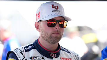 Aug 31, 2024; Darlington, South Carolina, USA; NASCAR Cup Series driver William Byron (24) stands in his pit box prior to practice for the Cook Out Southern 500 at Darlington Raceway.