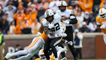 Nov 29, 2025; Knoxville, Tennessee, USA;  Vanderbilt Commodores running back Makhilyn Young (22) runs against the Tennessee Volunteers during the first half against at Neyland Stadium. Mandatory Credit: Randy Sartin-Imagn Images