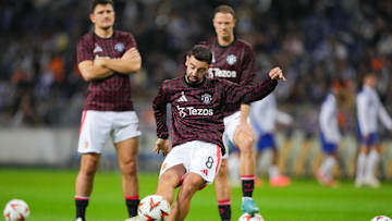 Bruno Fernandes (lower) won't have to serve a three-game suspension after Manchester United successfully appealed his red card vs. Tottenham Hotspur.