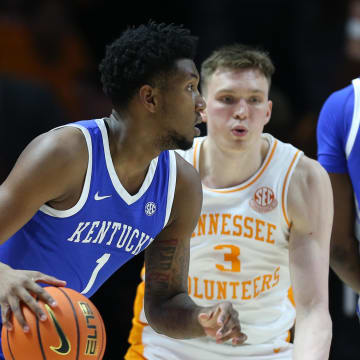 Mar 9, 2024; Knoxville, Tennessee, USA; Kentucky Wildcats guard Justin Edwards (1) moves the ball against Tennessee Volunteers guard Dalton Knecht (3) during the first half at Thompson-Boling Arena at Food City Center. Mandatory Credit: Randy Sartin-USA TODAY Sports