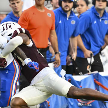 Texas A&M Aggies linebacker Daymion Sanford tackles Florida Gators wide receiver Vernell Brown III