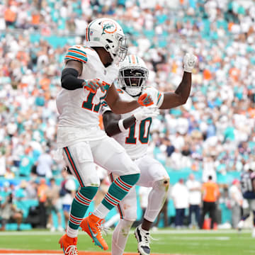 Miami Dolphins wide receiver Jaylen Waddle (17) celebrates his touchdown against the New England Patriots with wide receiver Tyreek Hill (10) during the second half at Hard Rock Stadium last season.