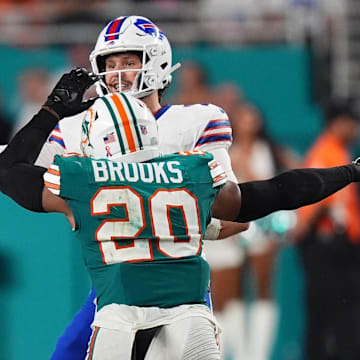 Miami Dolphins linebacker Jordyn Brooks (20) pressures Buffalo Bills quarterback Josh Allen (17) the second half at Hard Rock Stadium.