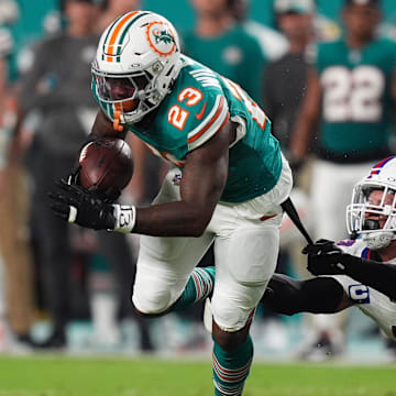 Buffalo Bills linebacker Terrel Bernard (43) reaches for Miami Dolphins running back Jeff Wilson Jr. (23) during the first half at Hard Rock Stadium.