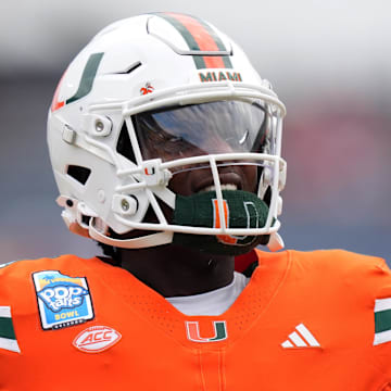 Dec 28, 2024; Orlando, FL, USA; Miami Hurricanes quarterback Cam Ward (1) warms up prior to the game against the Iowa State Cyclones at Camping World Stadium. Mandatory Credit: Jasen Vinlove-Imagn Images