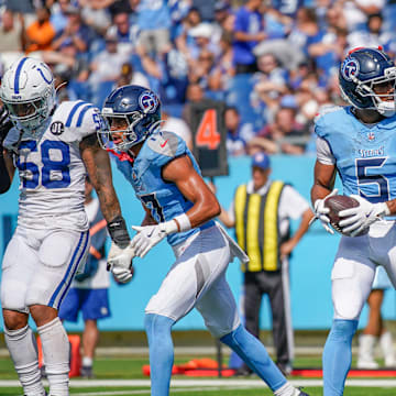 Tennessee Titans wide receiver Elic Ayomanor (5) celebrates his touchdown with wide receiver Calvin Ridley (0) during the fourth quarter against the Indianapolis Colts at Nissan Stadium in Nashville, Tenn., Sunday, Sept. 21, 2025.