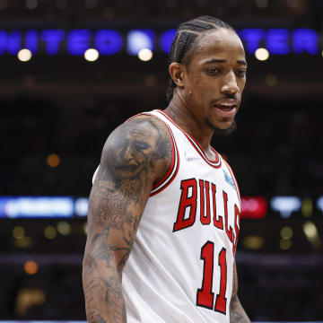 Feb 6, 2022; Chicago, Illinois, USA; Chicago Bulls forward DeMar DeRozan (11) reacts as he walks on the court during the second half of an NBA game against the Philadelphia 76ers at United Center. Mandatory Credit: Kamil Krzaczynski-USA TODAY Sports