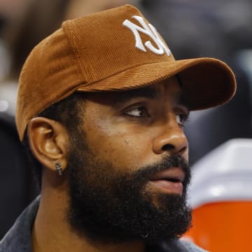 Dec 28, 2023; Minneapolis, Minnesota, USA; Dallas Mavericks guard Kyrie Irving (11) watches as his team plays the Minnesota Timberwolves in the second quarter at Target Center. Mandatory Credit: Bruce Kluckhohn-USA TODAY Sports