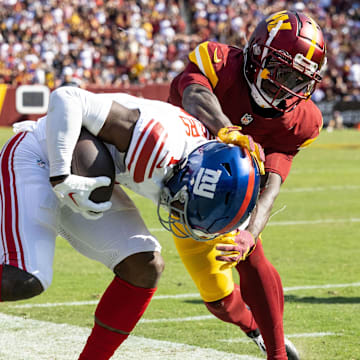 Sep 15, 2024; Landover, Maryland, USA; Washington Commanders cornerback Benjamin St-Juste (25) forces New York Giants wide receiver Malik Nabers (1) out of bounds during the second half at Commanders Field.  