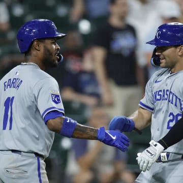 Jul 28, 2024; Chicago, Illinois, USA; Kansas City Royals third baseman Maikel Garcia (11) and second baseman Adam Frazier (26) celebrate after they both scored against the Chicago White Sox during the eight inning at Guaranteed Rate Field. Mandatory Credit: Kamil Krzaczynski-USA TODAY Sports