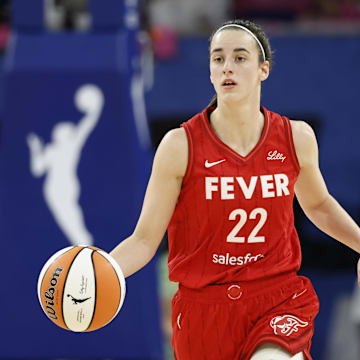 Aug 30, 2024; Chicago, Illinois, USA; Indiana Fever guard Caitlin Clark (22) brings the ball up court against the Chicago Sky during the first half at Wintrust Arena. Mandatory Credit: Kamil Krzaczynski-Imagn Images