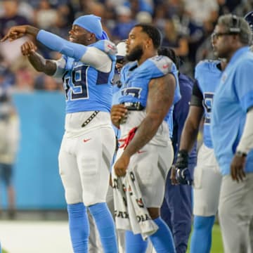 Tennessee Titans linebacker Dre'Mont Jones (45) signals to teammates during the second quarter of an NFL pre-season game against the Minnesota Vikings at Nissan Stadium in Nashville, Tenn., Friday, Aug. 22, 2025.