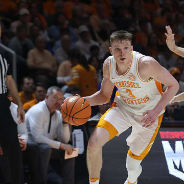 Mar 9, 2024; Knoxville, Tennessee, USA; Tennessee Volunteers guard Dalton Knecht (3) moves the ball against Kentucky Wildcats guard Reed Sheppard (15) during the second half at Thompson-Boling Arena at Food City Center. Mandatory Credit: Randy Sartin-USA TODAY Sports