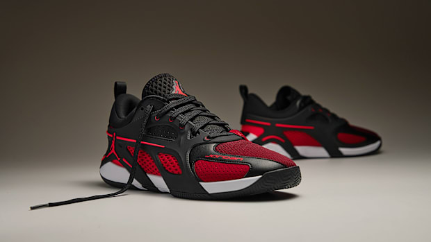 Red and black Jordan Brand basketball shoes.
