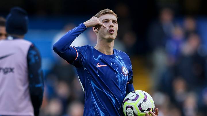 Cole Palmer celebrates with the match ball against Brighton.