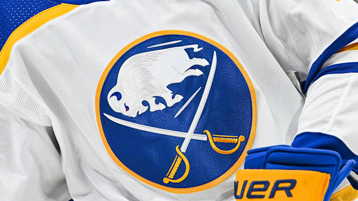 Nov 22, 2022; Montreal, Quebec, CAN; View of a Buffalo Sabres logo on a jersey worn by a member of the team during warm-up before the game against the Montreal Canadiens at Bell Centre. Mandatory Credit: David Kirouac-Imagn Images
