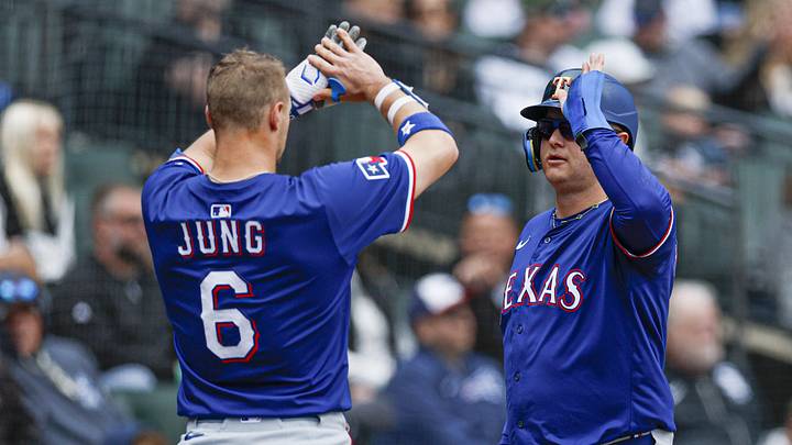May 24, 2025; Chicago, Illinois, USA; Texas Rangers designated hitter Joc Pederson (4) celebrates with third baseman Josh Jung (6) after scoring against the Chicago White Sox during the fourth inning at Rate Field. Mandatory Credit: Kamil Krzaczynski-Imagn Images