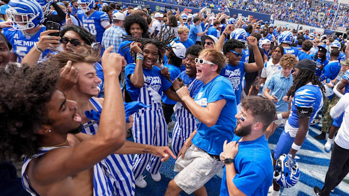 Memphis fans stormed the field celebrate after the Tigers defeated Arkansas 32-31.