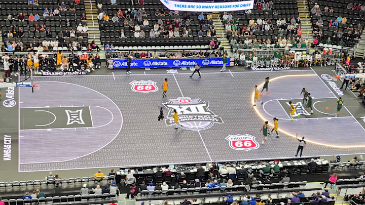 The 3-point line of the ASB GlassFloor LED court lights up during  the 2026 Big 12 men's basketball tournament in T-Mobile Center at Kansas City. The Big 12 introduced the LED court to the conference tournaments this year.