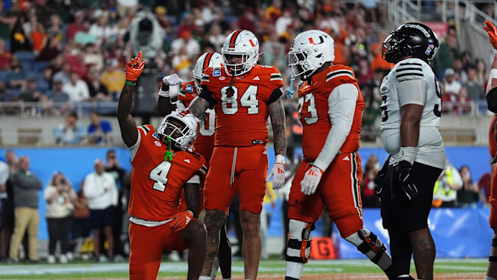 Dec 28, 2024; Orlando, FL, USA; Miami Hurricanes running back Mark Fletcher Jr. (4) celebrates after scoring a touchdown against the Iowa State Cyclones during the second half at Camping World Stadium. Mandatory Credit: Jasen Vinlove-Imagn Images