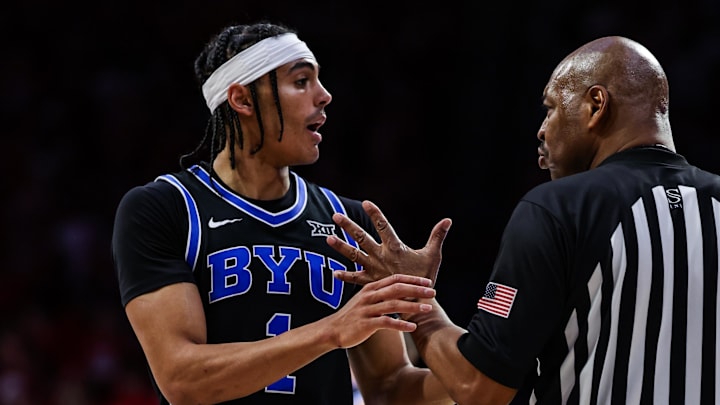 Feb 22, 2025; Tucson, Arizona, USA; BYU Cougars guard Trey Stewart (1) talks with the referee after he threw the ball at Arizona Wildcats head coach Tommy Lloyd by accident during the second half at McKale Center. Mandatory Credit: Aryanna Frank-Imagn Images