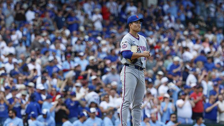 Apr 17, 2026; Chicago, Illinois, USA; New York Mets starting pitcher Kodai Senga (34) reacts after giving up a two-run home run to Chicago Cubs second baseman Nico Hoerner during the second inning at Wrigley Field. Mandatory Credit: Kamil Krzaczynski-Imagn Images