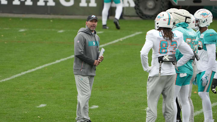 Nov 2, 2023; Frankfurt, Germany; Miami Dolphins special teams coordinator Danny Crossman (left) talks with wide receiver Raleigh Webb (83) and linebacker Cameron Goode (53) during practice at the PSD Bank Arena. Mandatory Credit: Kirby Lee-USA TODAY Sports