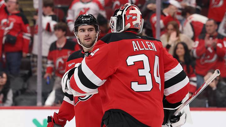 Oct 16, 2025; Newark, New Jersey, USA; New Jersey Devils center Nico Hischier (13) and New Jersey Devils goaltender Jake Allen (34) celebrate the Devils win over the Florida Panthers at Prudential Center. Mandatory Credit: Ed Mulholland-Imagn Images