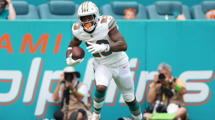 Oct 29, 2023; Miami Gardens, Florida, USA; Miami Dolphins running back Jeff Wilson Jr. (23) runs the ball against the New England Patriots during the second half at Hard Rock Stadium. Mandatory Credit: Jasen Vinlove-USA TODAY Sports