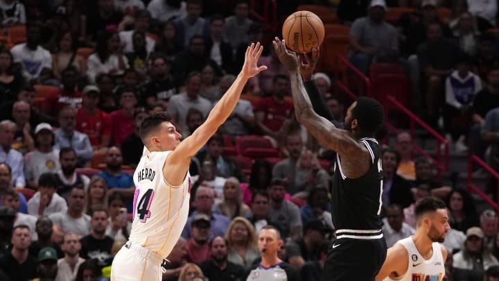 Dec 8, 2022; Miami, Florida, USA; LA Clippers guard John Wall (11) shoots over Miami Heat guard Tyler Herro (14) during the second half at FTX Arena. 