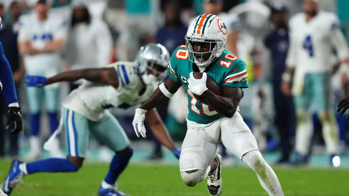 Miami Dolphins wide receiver Tyreek Hill (10) runs with the ball after a catch during the second half against the Dallas Cowboys at Hard Rock Stadium last season.