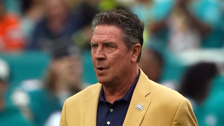 Dec 24, 2023; Miami Gardens, Florida, USA; Hall of Famer Dan Marino walks onto the field before the game between the Miami Dolphins and the Dallas Cowboys at Hard Rock Stadium.