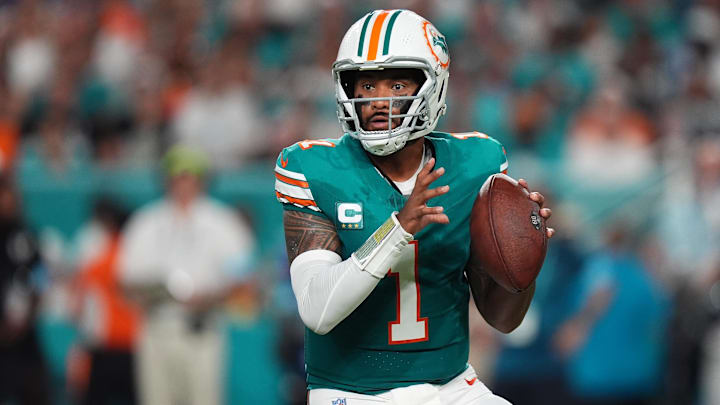 Miami Dolphins quarterback Tua Tagovailoa (1) drops back with the ball against the Buffalo Bills during the first half at Hard Rock Stadium. Mandatory Credit: Jasen Vinlove-Imagn Images