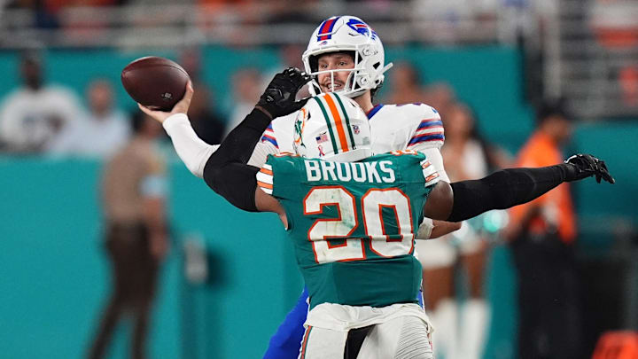 Miami Dolphins linebacker Jordyn Brooks (20) pressures Buffalo Bills quarterback Josh Allen (17) the second half at Hard Rock Stadium.